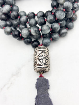 eagle eye gemstone mala necklace with etched silver guru bead and gray silk ribbon tassel | radiant malas | handmade in boulder, colorado