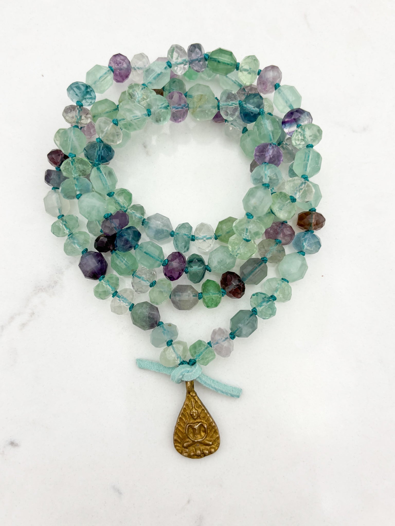 fluorite gemstone mala with brass Buddha pendant | radiant malas  handmade in boulder, colorado