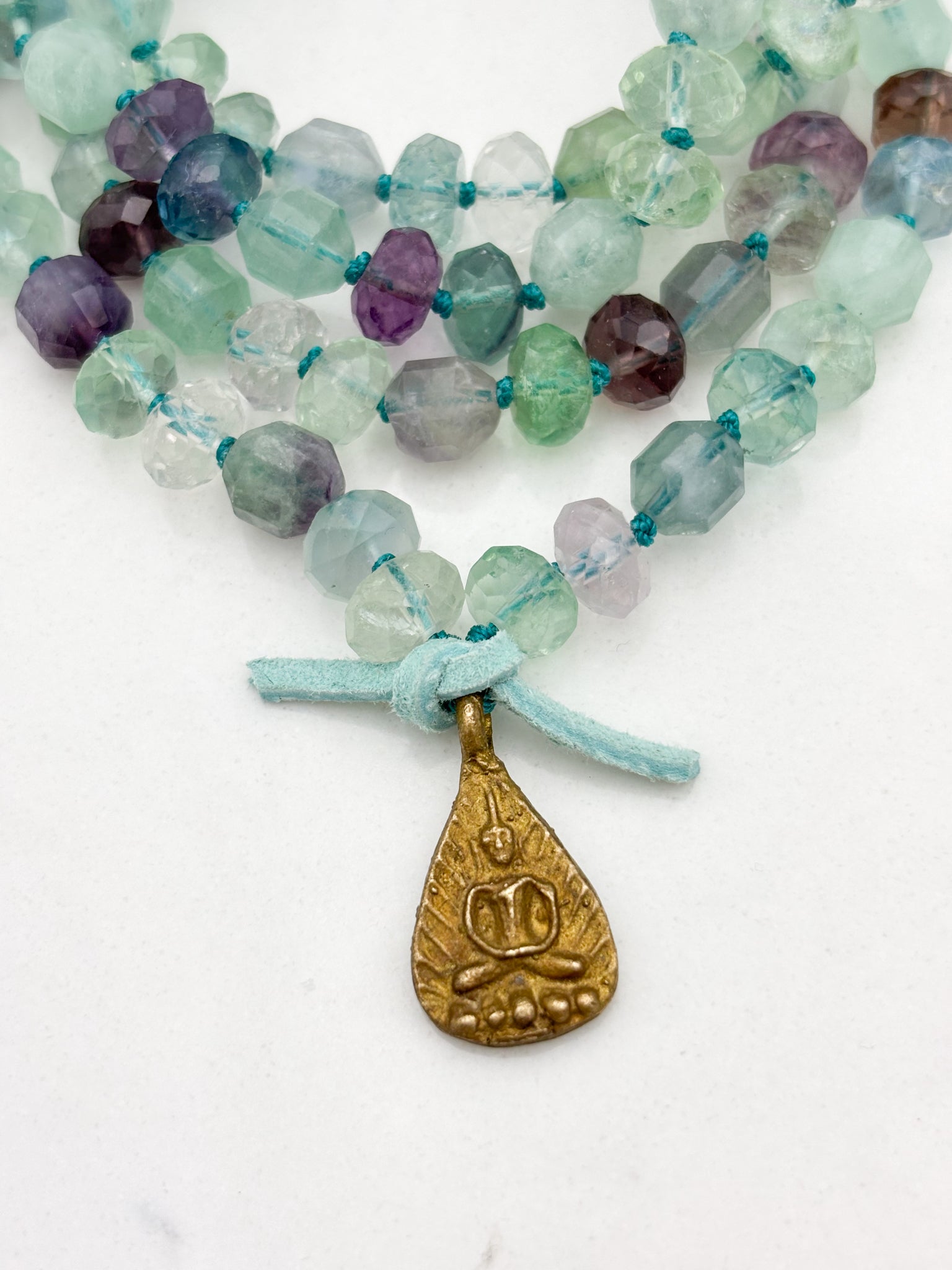 fluorite gemstone mala with brass Buddha pendant | radiant malas  handmade in boulder, colorado