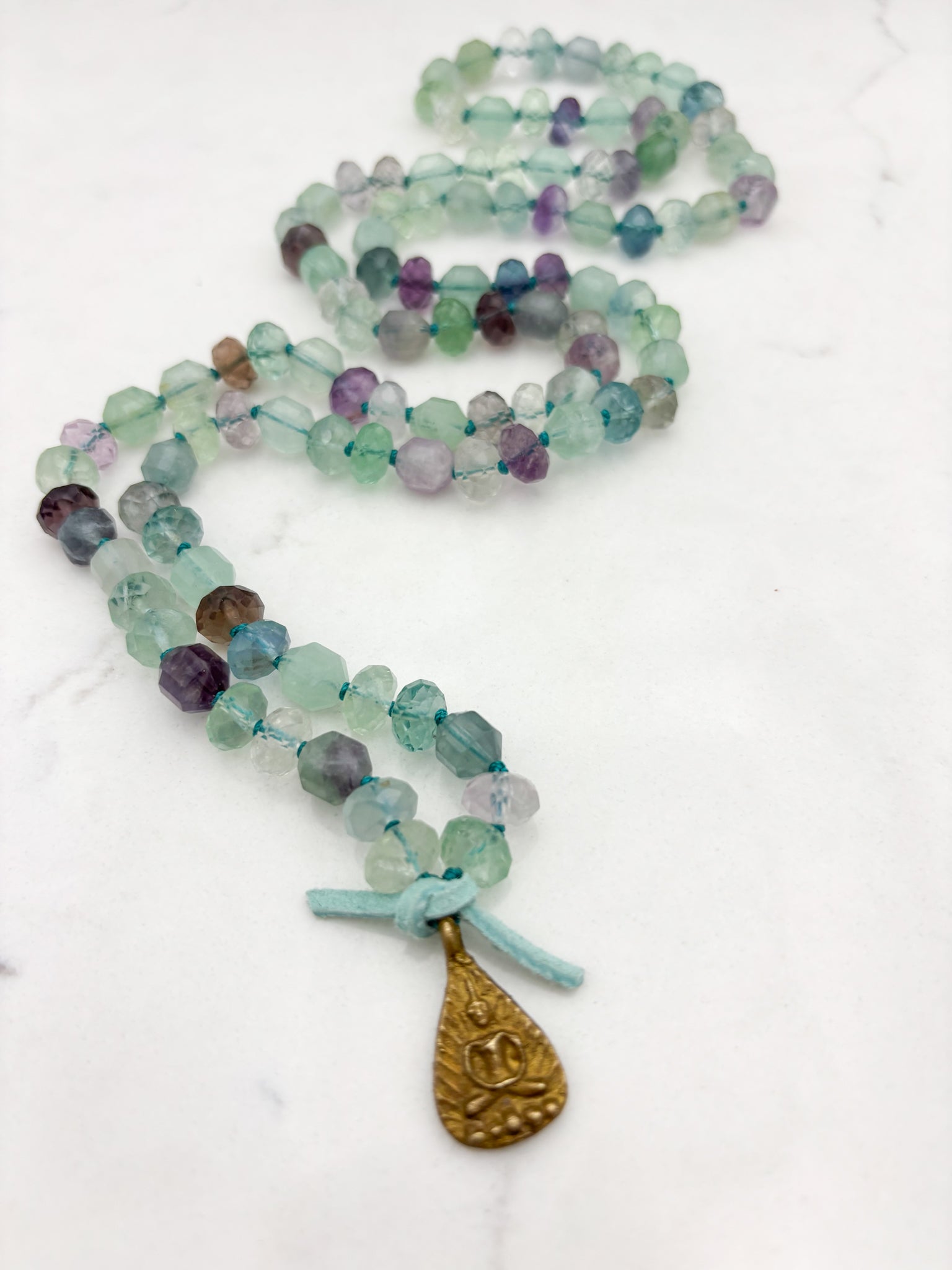 fluorite gemstone mala with brass Buddha pendant | radiant malas  handmade in boulder, colorado