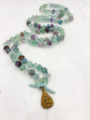 fluorite gemstone mala with brass Buddha pendant | radiant malas  handmade in boulder, colorado
