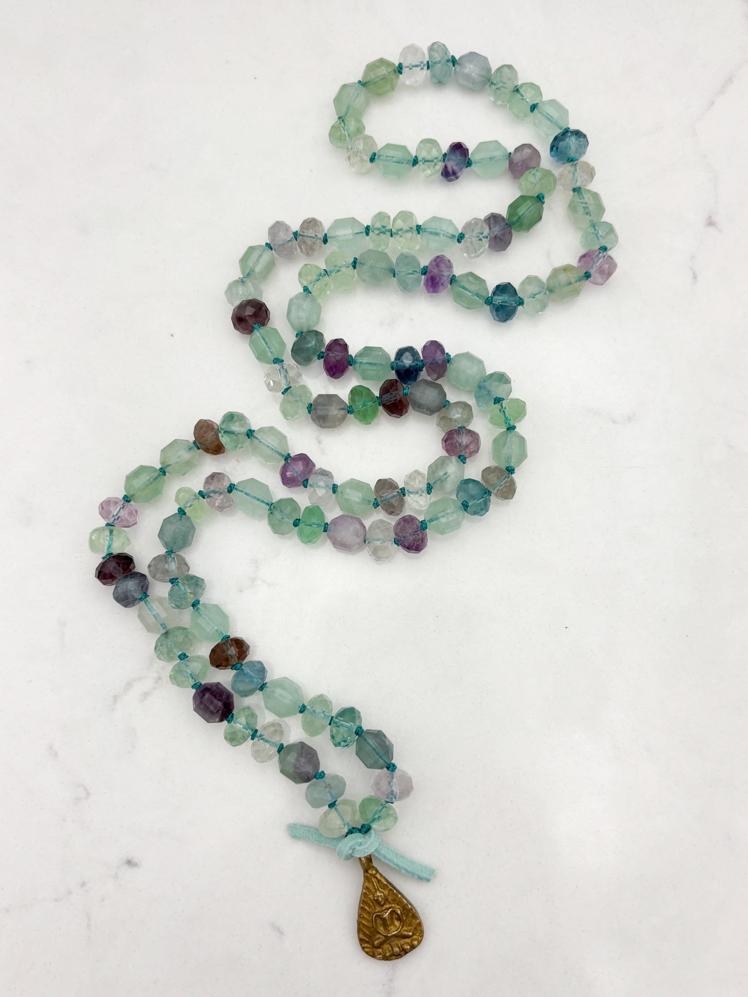 fluorite gemstone mala with brass Buddha pendant | radiant malas  handmade in boulder, colorado