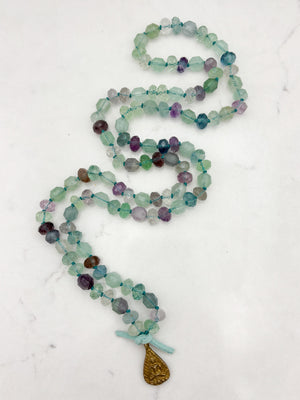 fluorite gemstone mala with brass Buddha pendant | radiant malas  handmade in boulder, colorado