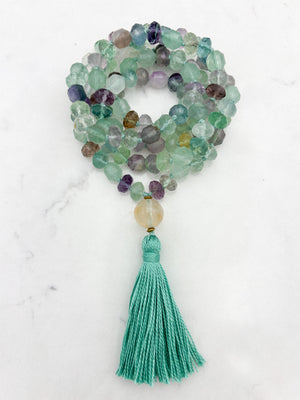 fluorite gemstone mala with golden quartz guru bead and mint green tassel | radiant malas  handmade in boulder, colorado