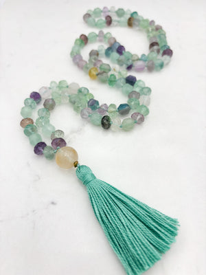 fluorite gemstone mala with golden quartz guru bead and mint green tassel | radiant malas  handmade in boulder, colorado