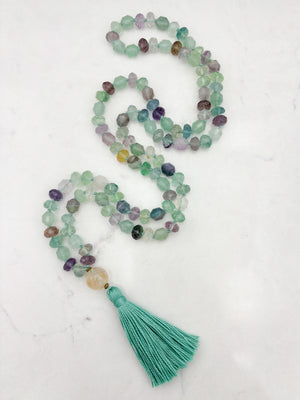 fluorite gemstone mala with golden quartz guru bead and mint green tassel | radiant malas  handmade in boulder, colorado