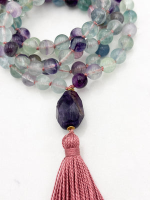 fluorite gemstone mala with amethyst guru bead and pink tassel | radiant malas  handmade in boulder, colorado