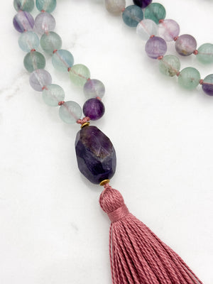 fluorite gemstone mala with amethyst guru bead and pink tassel | radiant malas  handmade in boulder, colorado