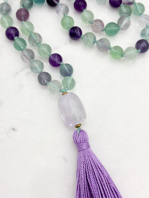 fluorite gemstone mala with amethyst guru bead and purple tassel | radiant malas  handmade in boulder, colorado