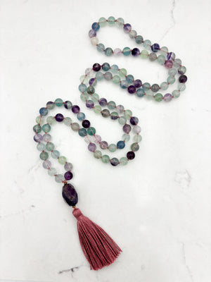 fluorite gemstone mala with amethyst guru bead and pink tassel | radiant malas  handmade in boulder, colorado