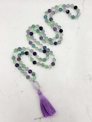 fluorite gemstone mala with amethyst guru bead and purple tassel | radiant malas  handmade in boulder, colorado