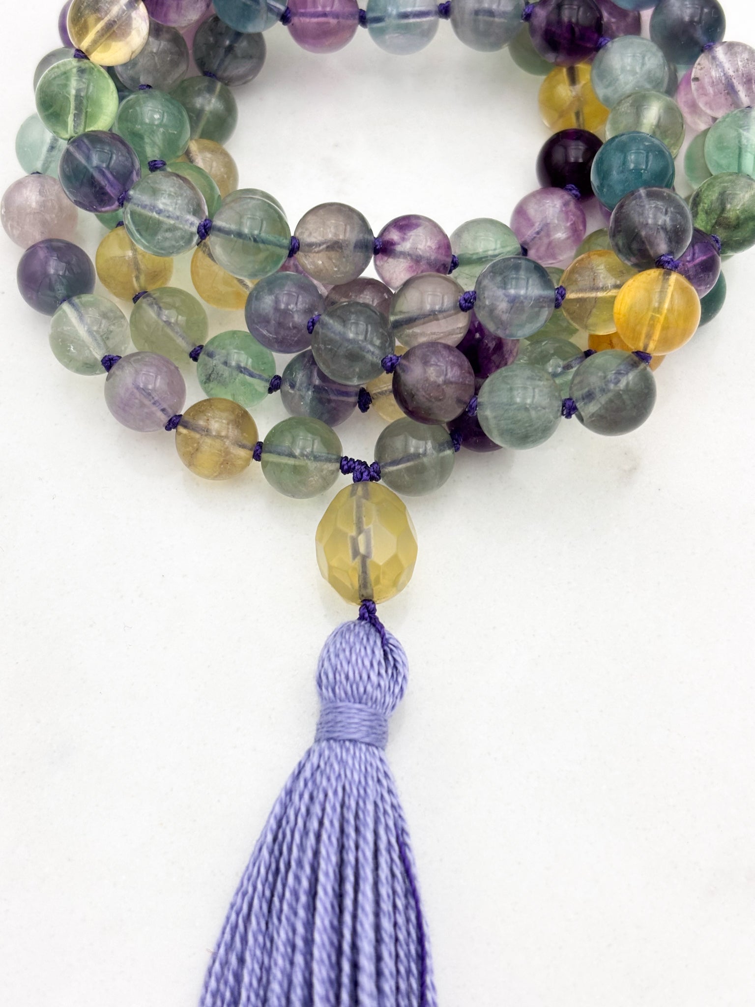 fluorite gemstone mala with citrine guru bead and lilac tassel | radiant malas  handmade in boulder, colorado