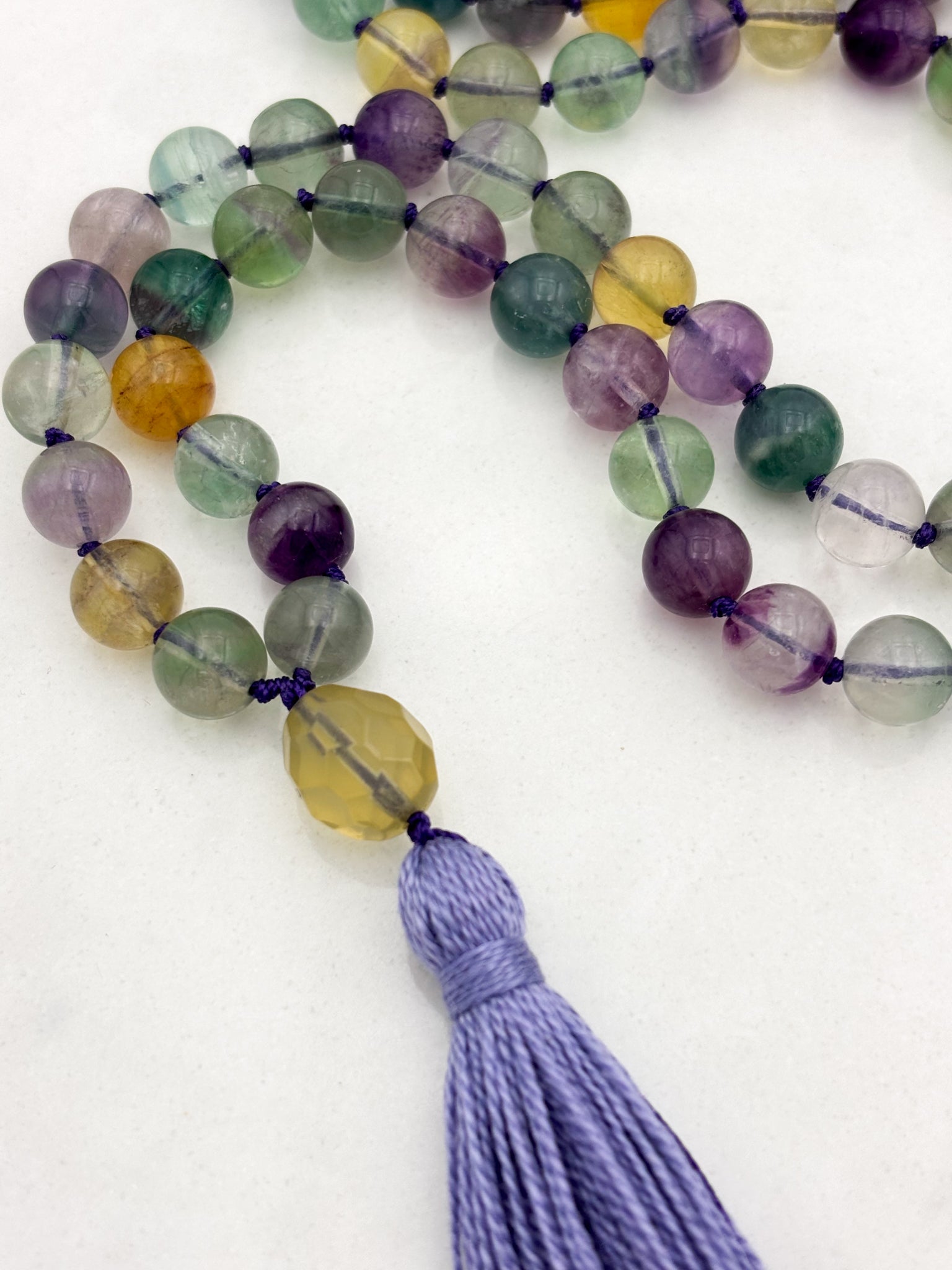 fluorite gemstone mala with citrine guru bead and lilac tassel | radiant malas  handmade in boulder, colorado