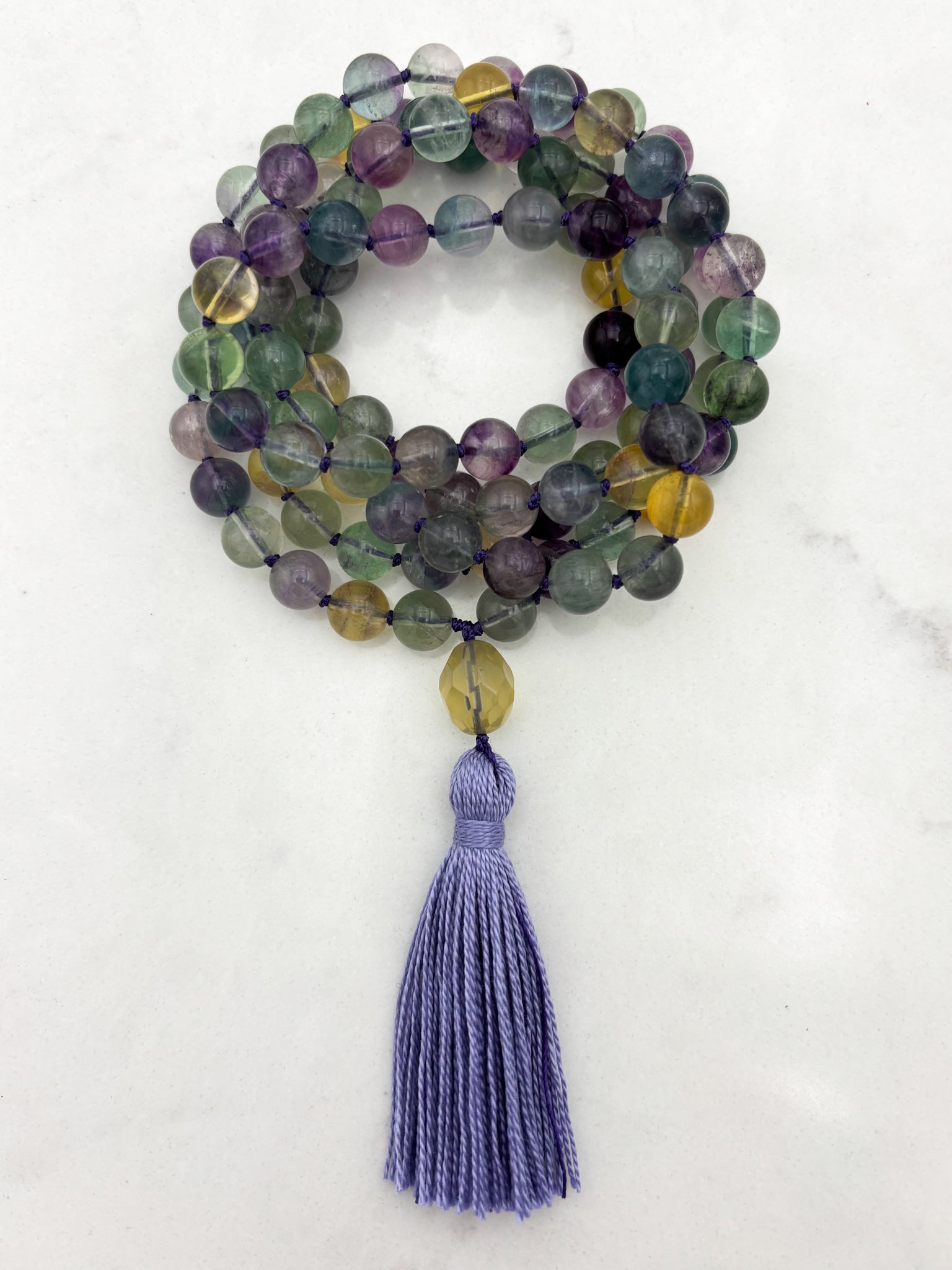 fluorite gemstone mala with citrine guru bead and lilac tassel | radiant malas  handmade in boulder, colorado