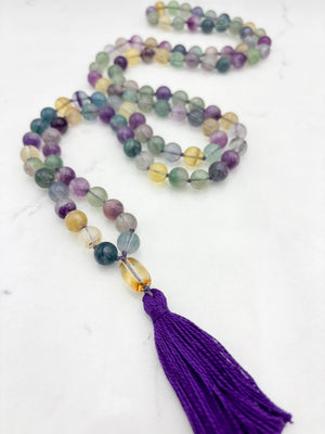 fluorite gemstone mala with citrine guru bead and purple tassel | radiant malas  handmade in boulder, colorado