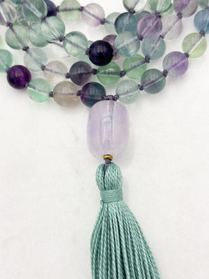 fluorite gemstone mala with amethyst guru bead and purple tassel | radiant malas  handmade in boulder, colorado