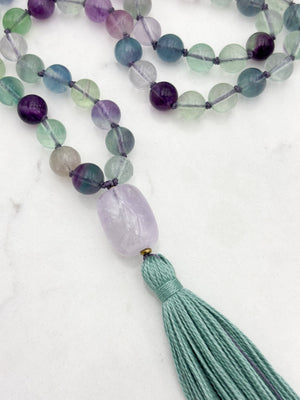 fluorite gemstone mala with amethyst guru bead and purple tassel | radiant malas  handmade in boulder, colorado