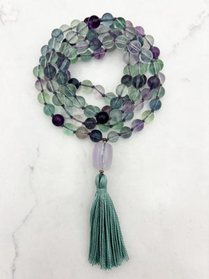 fluorite gemstone mala with amethyst guru bead and purple tassel | radiant malas  handmade in boulder, colorado