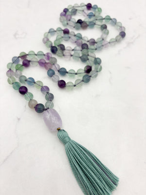 fluorite gemstone mala with amethyst guru bead and purple tassel | radiant malas  handmade in boulder, colorado