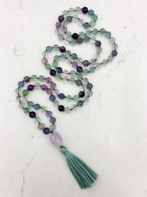 fluorite gemstone mala with amethyst guru bead and purple tassel | radiant malas  handmade in boulder, colorado