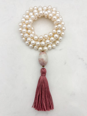 freshwater pearl mala necklace with fossil coral guru bead and rose pink tassel | radiant malas | handmade in boulder, colorado