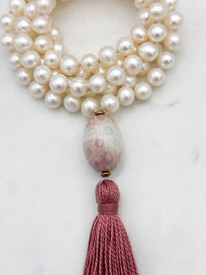 freshwater pearl mala necklace with fossil coral guru bead and rose pink tassel | radiant malas | handmade in boulder, colorado