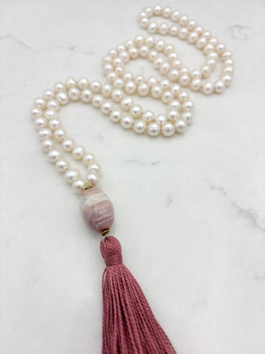 freshwater pearl mala necklace with fossil coral guru bead and rose pink tassel | radiant malas | handmade in boulder, colorado