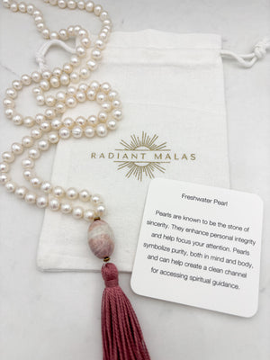 freshwater pearl mala necklace with fossil coral guru bead and rose pink tassel | radiant malas | handmade in boulder, colorado