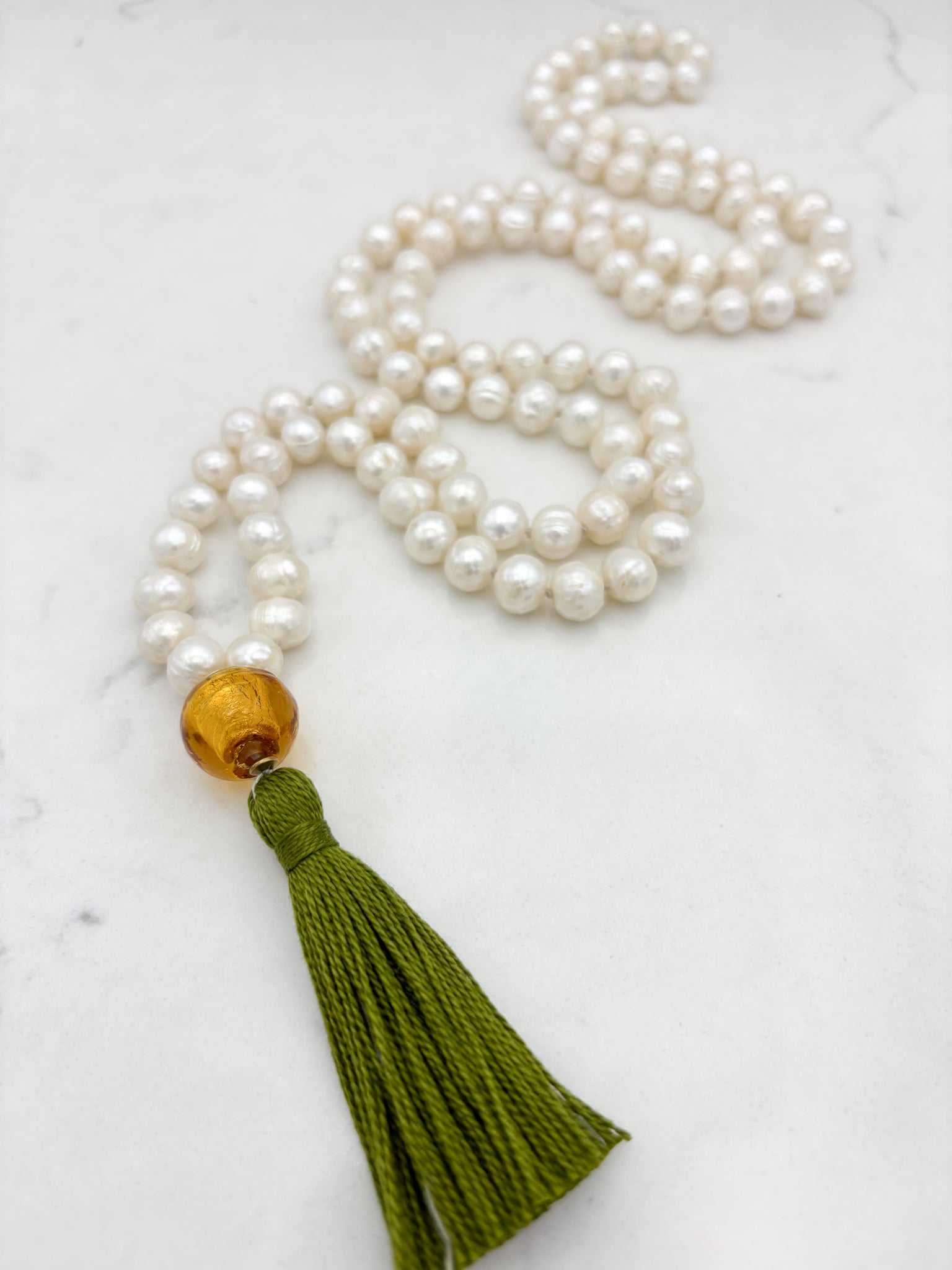 freshwater pearl mala necklace with lampwork glass guru bead and green tassel | radiant malas | handmade in boulder, colorado