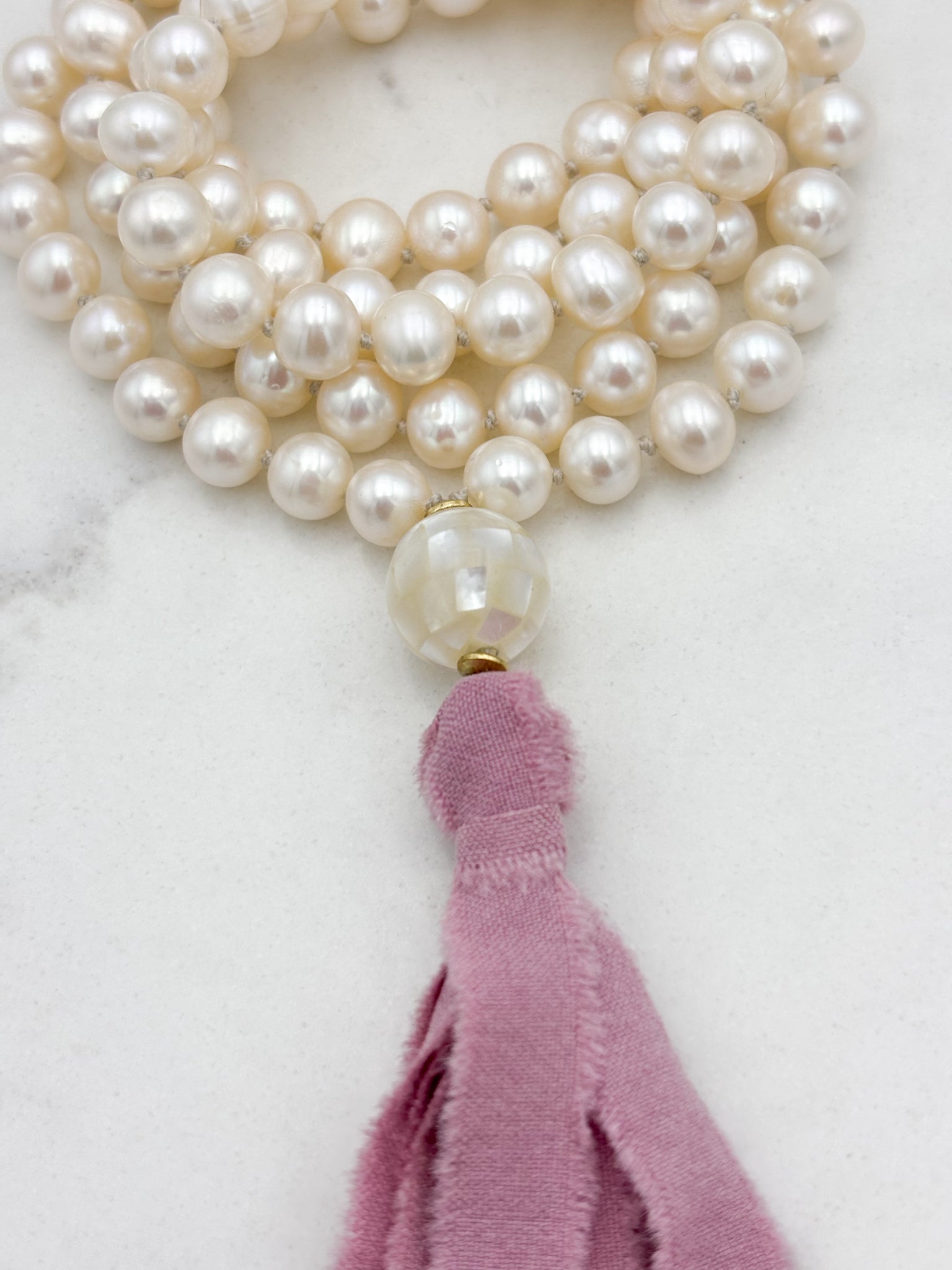 freshwater pearl mala necklace with mosaci mother of pearl guru bead and  pink silk tassel | radiant malas | handmade in boulder, colorado