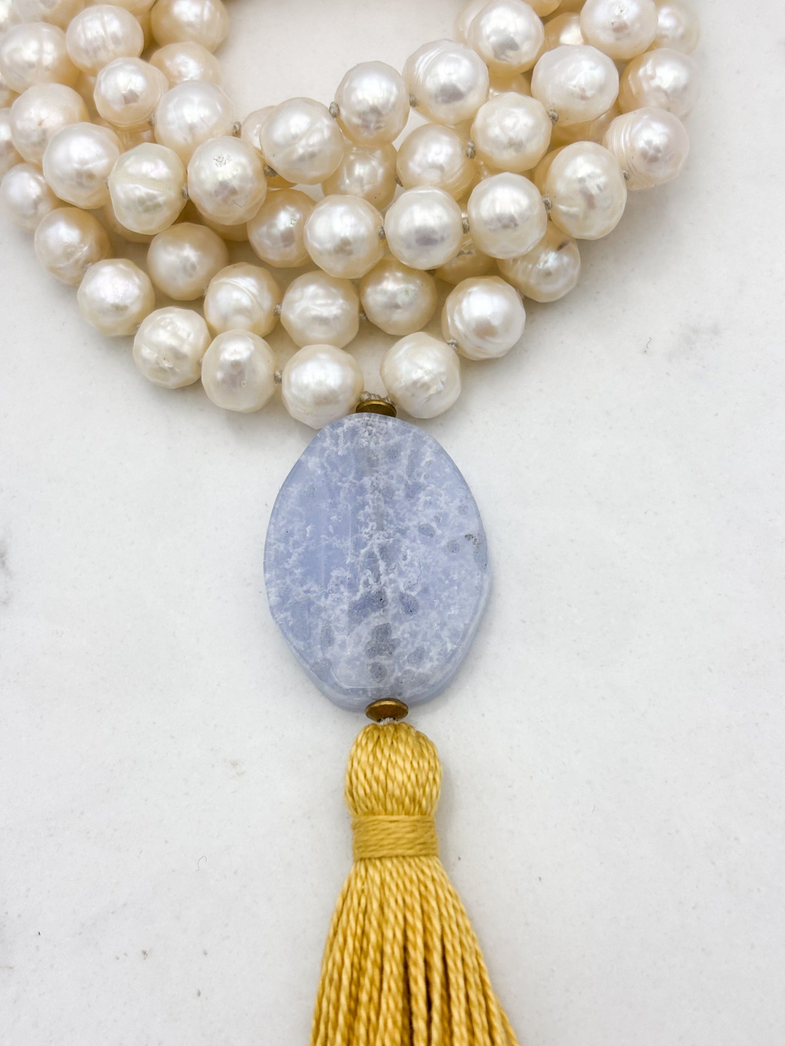 freshwater pearl mala necklace with blue lace agate guru bead and gold tassel | radiant malas | handmade in boulder, colorado