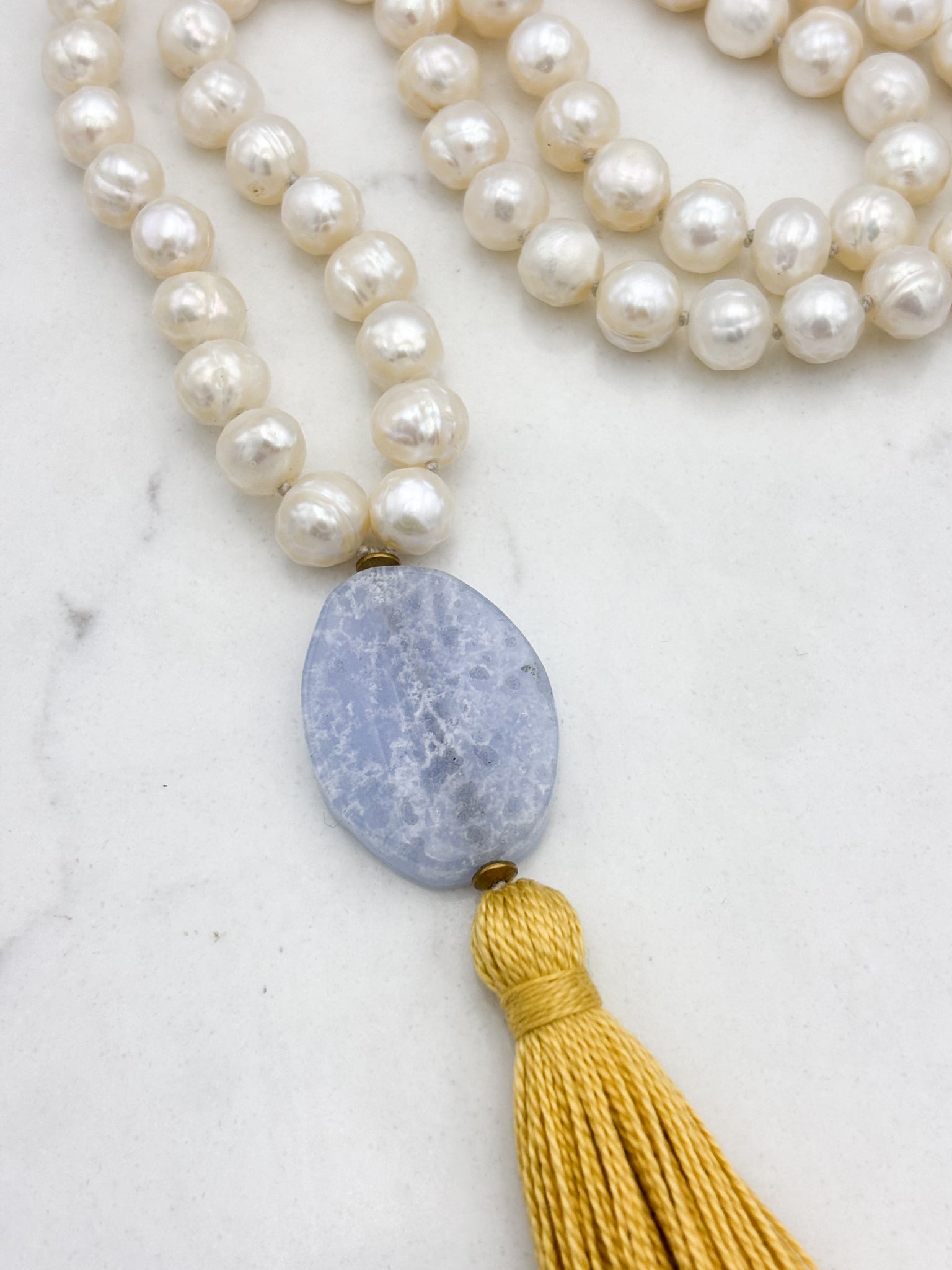 freshwater pearl mala necklace with blue lace agate guru bead and gold tassel | radiant malas | handmade in boulder, colorado