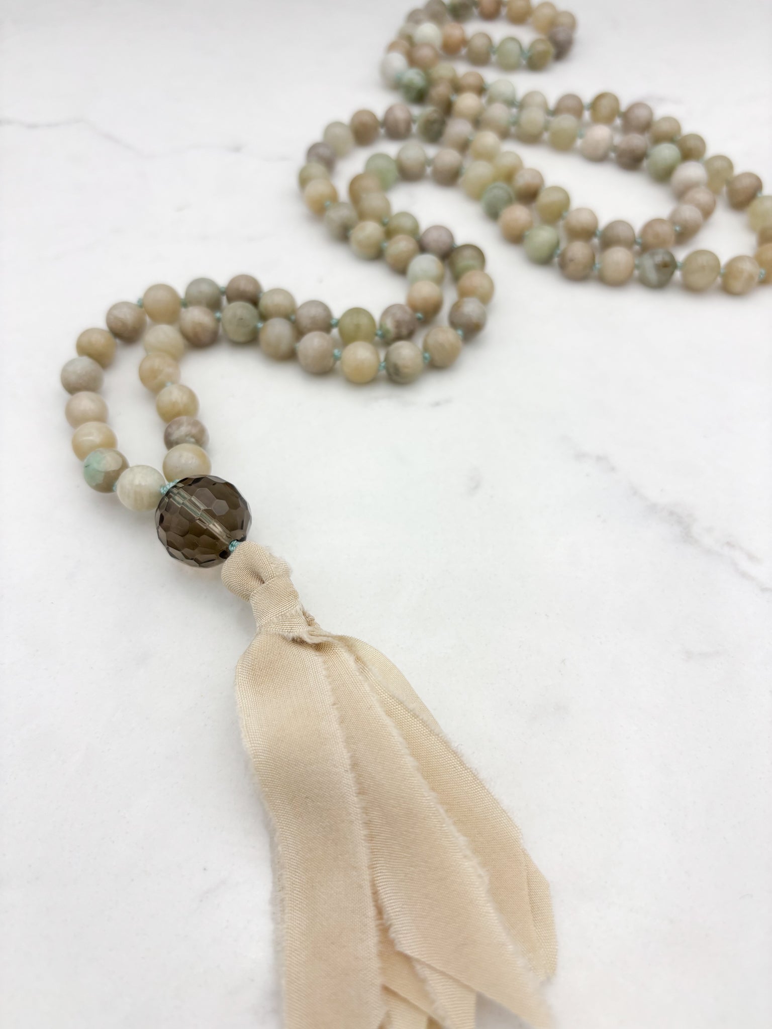 madagascar moonstone gemstone mala necklace with smoky quartz guru bead and cream silk tassel | handmade in boulder, colorado | radiant malas