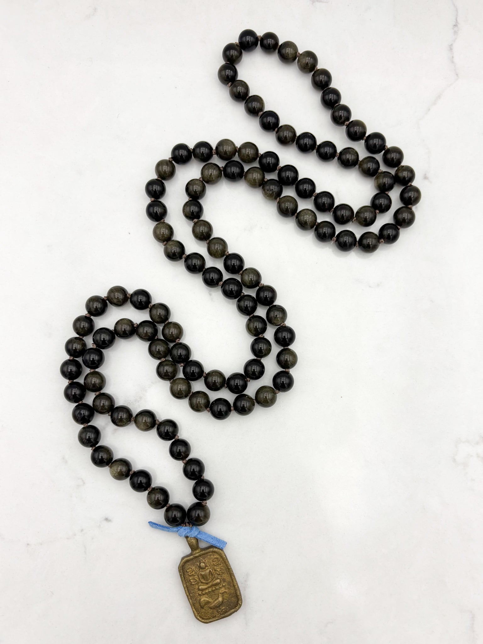 golden obsidian gemstone mala with Buddha pendant | radiant malas  handmade in boulder, colorado