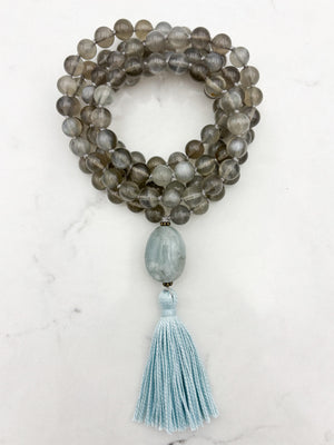 gray moonstone gemstone mala necklace with aquamarine guru bead and blue tassel | handmade in boulder, colorado | radiant malas