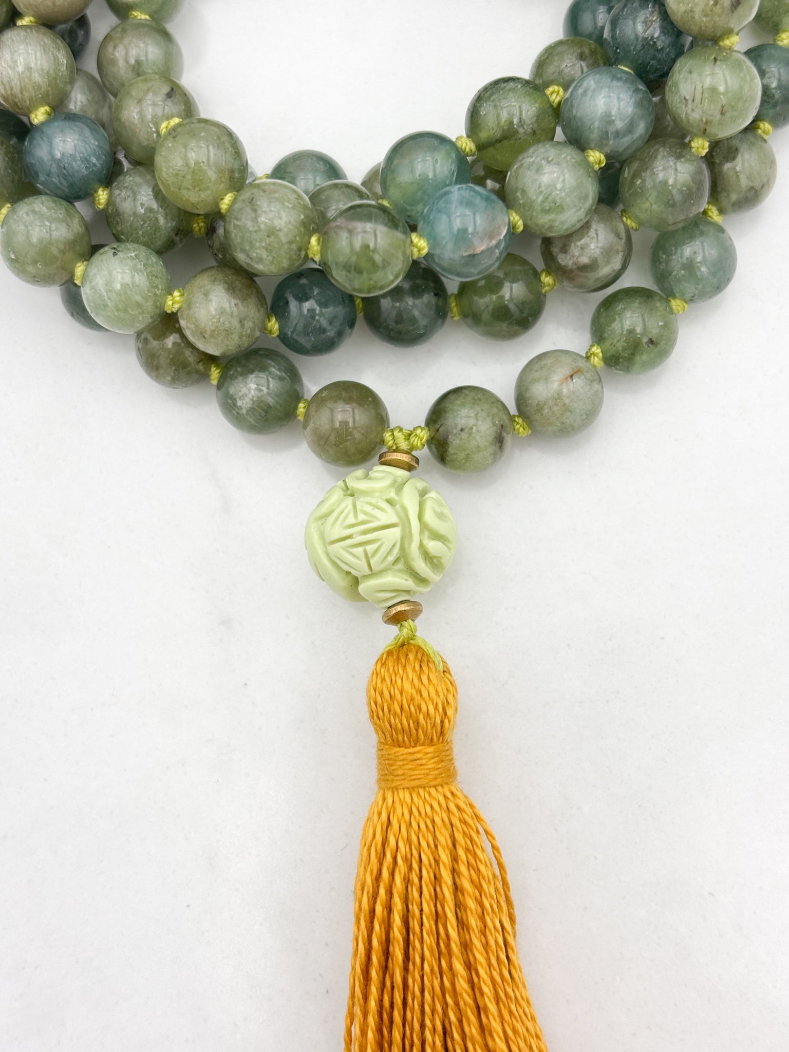 green apatite gemstone mala with carved lemon turquoise guru bead and gold tassel | radiant malas | handmade in boulder, colorado
