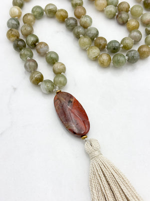 green garnet gemstone mala with red jasper guru bead and cream colored tassel | radiant malas | handmade in boulder, colorado