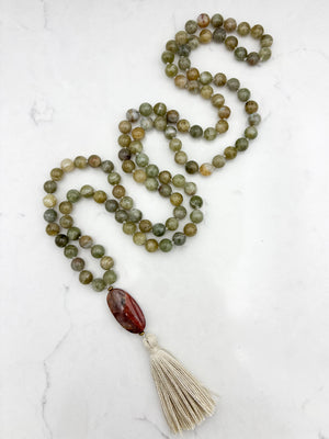 green garnet gemstone mala with red jasper guru bead and cream colored tassel | radiant malas | handmade in boulder, colorado