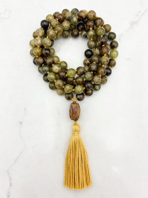 green garnet gemstone mala with palmwood guru bead and yellow colored tassel | radiant malas | handmade in boulder, colorado