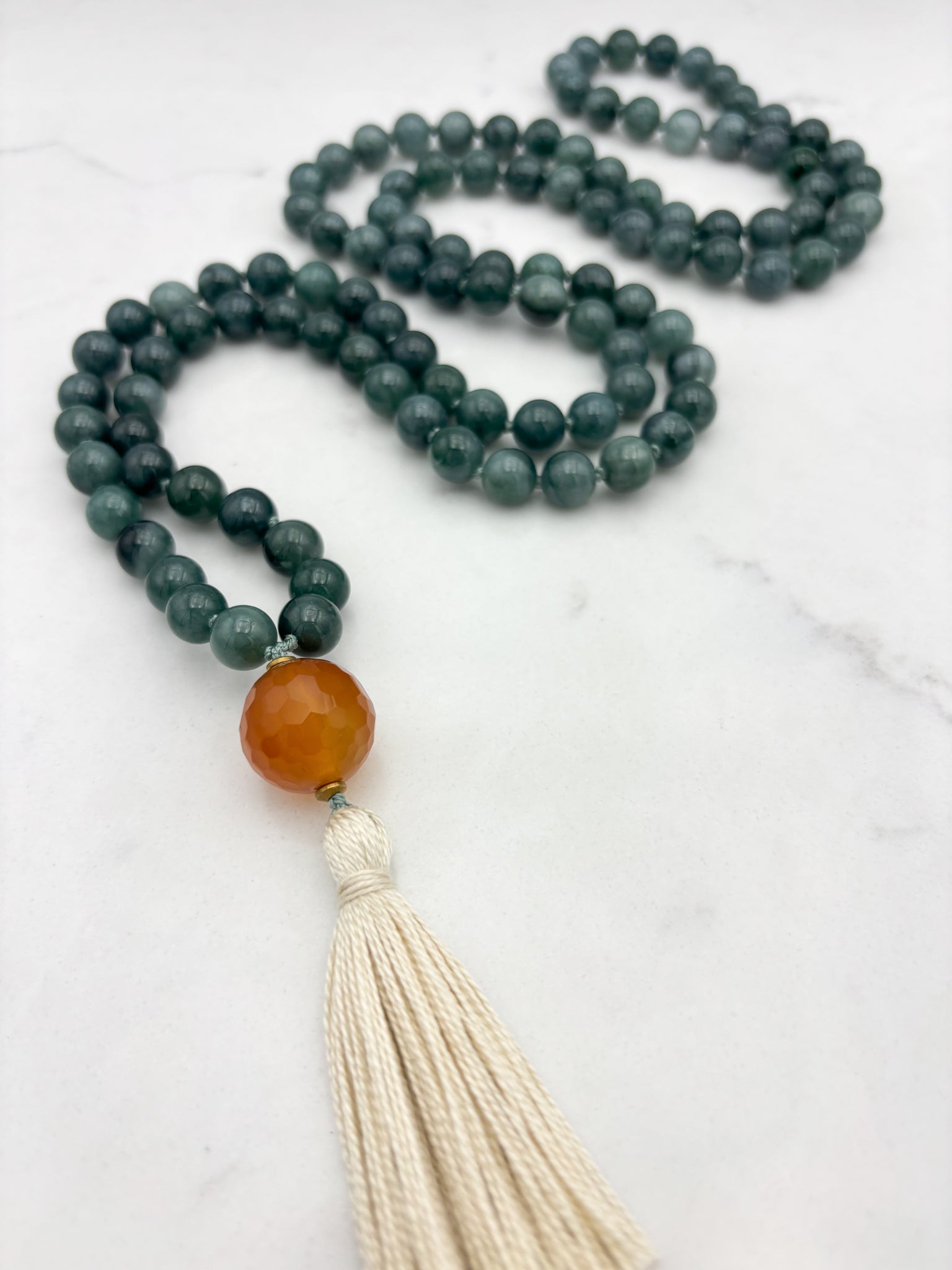 guatemalan jade gemstone mala with carnelian guru bead and cream tassel | radiant malas | handmade in boulder, colorado