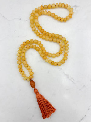 Honey Calcite gemstone mala with carnelian guru bead and orange tassel | radiant malas  | handmade in boulder, colorado