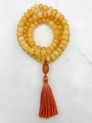 Honey Calcite gemstone mala with carnelian guru bead and orange tassel | radiant malas  | handmade in boulder, colorado