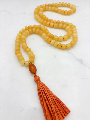 Honey Calcite gemstone mala with carnelian guru bead and orange tassel | radiant malas  | handmade in boulder, colorado