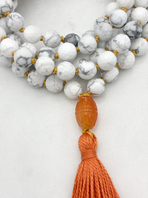 howlite gemstone mala with carnelian guru bead and orange tassel | radiant malas | handmade in boulder, colorado