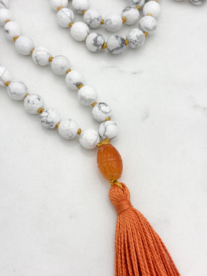 howlite gemstone mala with carnelian guru bead and orange tassel | radiant malas | handmade in boulder, colorado