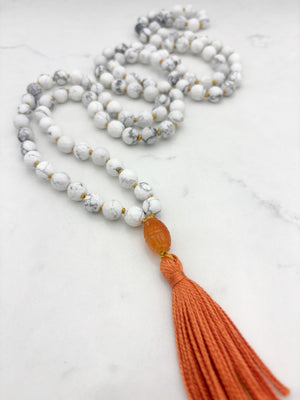 howlite gemstone mala with carnelian guru bead and orange tassel | radiant malas | handmade in boulder, colorado