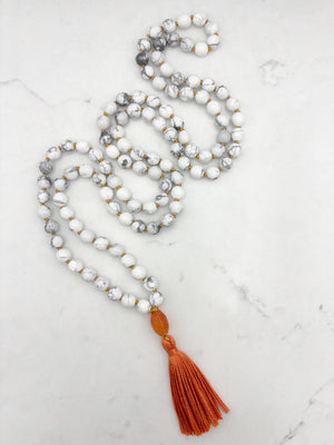 howlite gemstone mala with carnelian guru bead and orange tassel | radiant malas | handmade in boulder, colorado