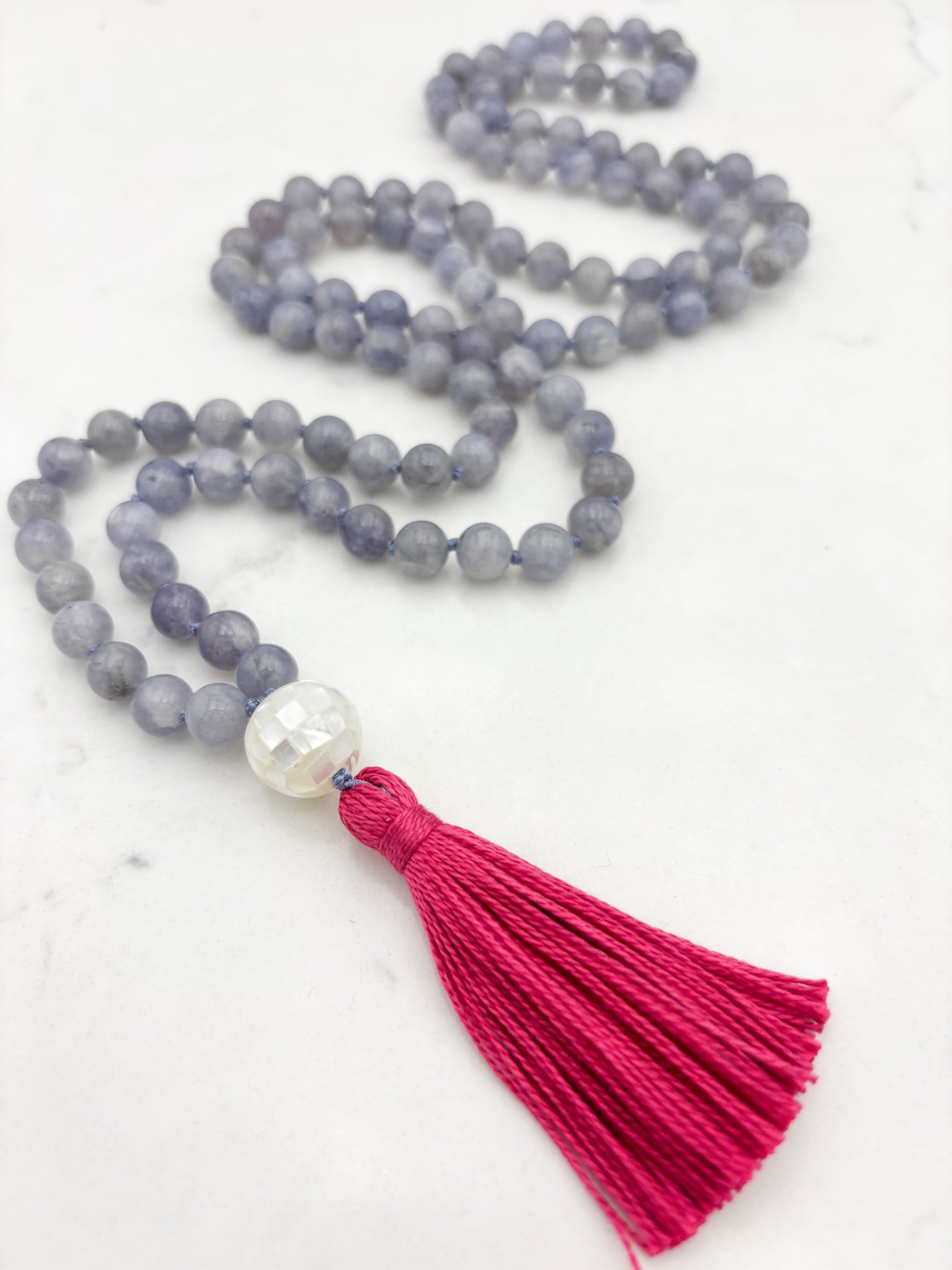 iolite gemstone mala with mosaic mother of pearl guru bead and pink tassel | radiant malas | handmade in boulder, colorado