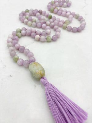 kunzite gemstone mala with beryl guru bead and lilac tassel | radiant malas  handmade in boulder, colorado