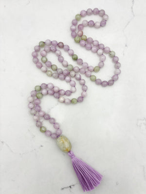 kunzite gemstone mala with beryl guru bead and lilac tassel | radiant malas  handmade in boulder, colorado